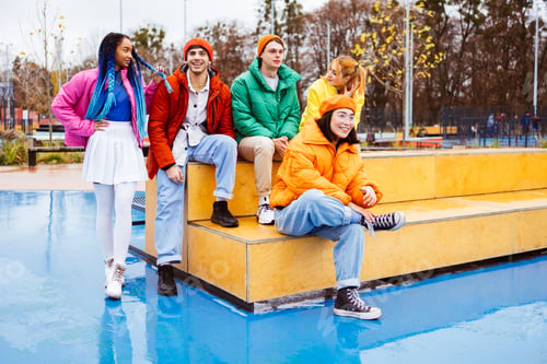 Preview: Multiracial group of young friends meeting outdoors in winter