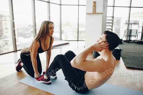 Preview: Sports couple in a morning gym