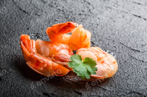 Preview: Closeup of fresh seafood on a black stone