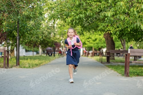 Preview: Beautiful schoolgirl runs with backpack to school. Concept back to school, education