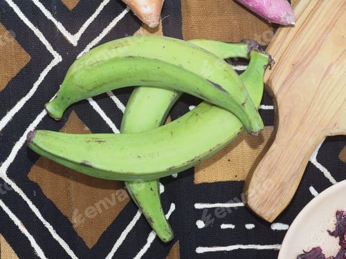 Preview: woman holding ripe plantain as ingredient for african food