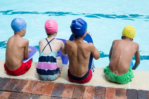 Preview: Girls and boys sitting at poolside