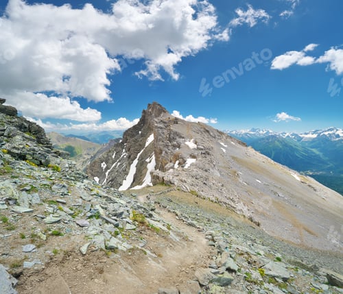 Preview: Panorama of mountain peaks and hills and stones, at summer day.