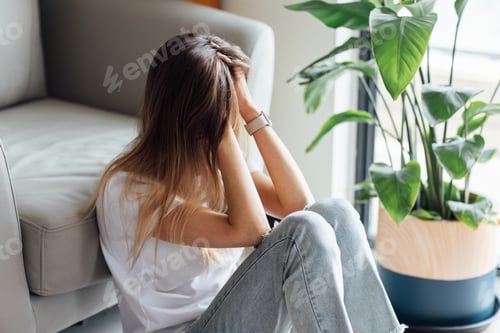Preview: Unhappy young caucasian woman with blonde hair thinking about bad relationships problems