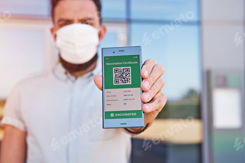 Preview: Hand man holding smartphone displaying on app mobile valid digital green vaccination certificate for