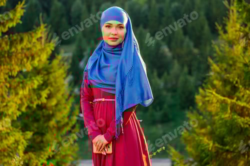 Preview: Portrait of beautiful Muslim woman with green eyes wearing blue scarf face