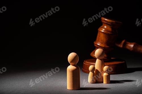 Preview: Wooden toy family and judge mallet. Family divorce concept