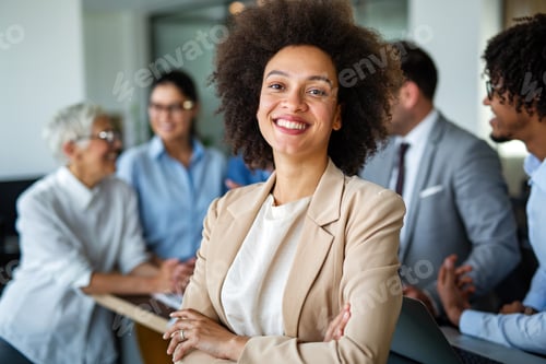 Preview: Portrait of a successful black business woman smiling in corporate office
