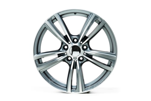 Preview: Closeup shot of metal wheel rims with a white background