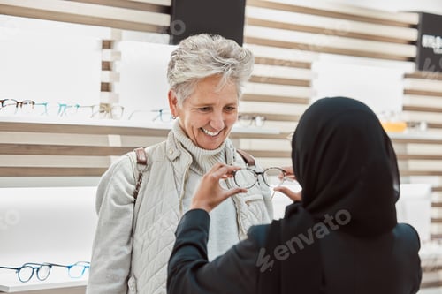 Preview: Glasses, vision and consulting with a senior woman in an optician office for prescription lenses. E