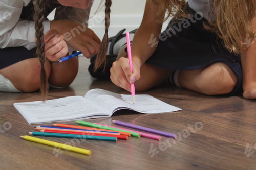 Preview: children do their homework and write in notebooks at home