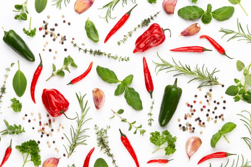 Preview: Spice herbal leaves and chili pepper on white background.
