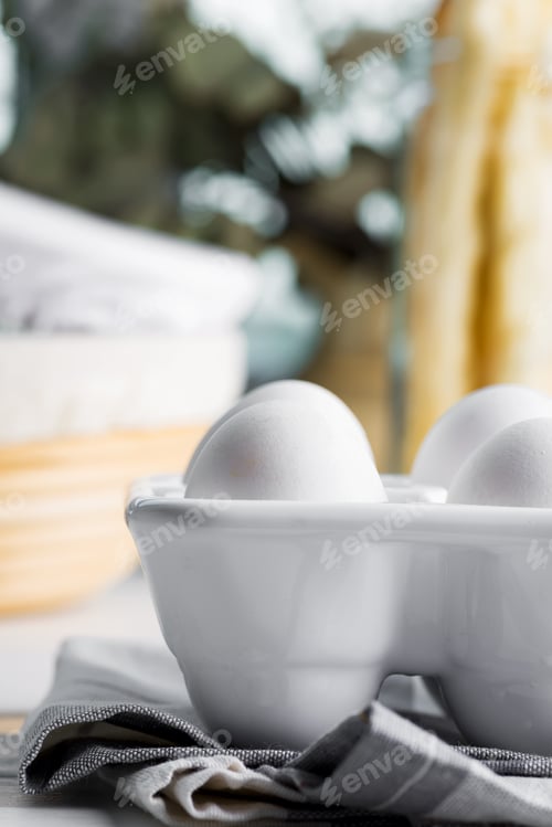 Preview: Ceramic container with natural organic farm eggs on a blurred kitchen background