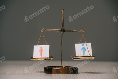 Preview: male and female symbols on scales on wooden table on grey, gender equality concept