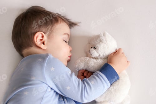 Preview: 🌟Nominated 🌟 Close up portrait of cute little baby boy in light blue pajamas sleeping peacefully on