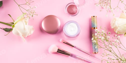 Preview: Trendy make up brushes with products on pink background with gypsophila flowers