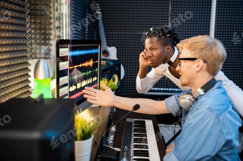 Preview: Young musicians looking at computer screen during discussion of sound waveforms