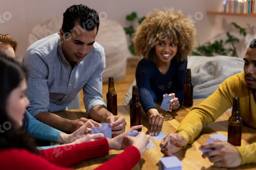 Preview: Millennial adult friends socialising together at home