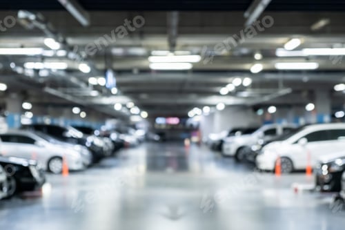 Preview: Blur not in focus underground full parked not empty car park at large department store.