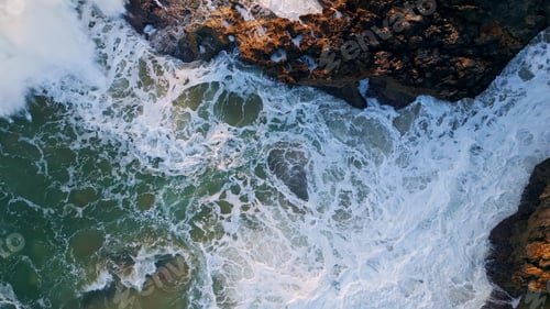 Preview: Powerful ocean waves crashing coastal rocks closeup. Rough sea water splashing
