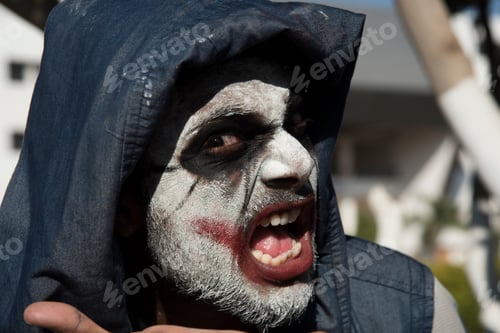 Preview: Close-up portrait of a horrible scary zombie man. Horror. Halloween.