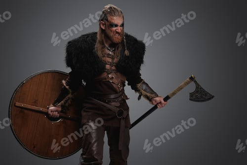 Preview: Furious viking from past holding shield and hatchet