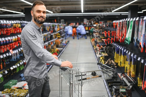 Preview: male builder in a hardware store