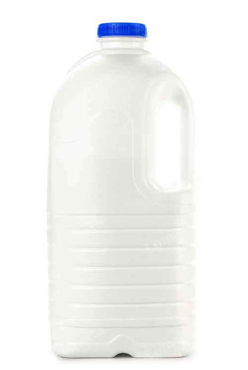 Preview: Big plastic bottle of milk on white