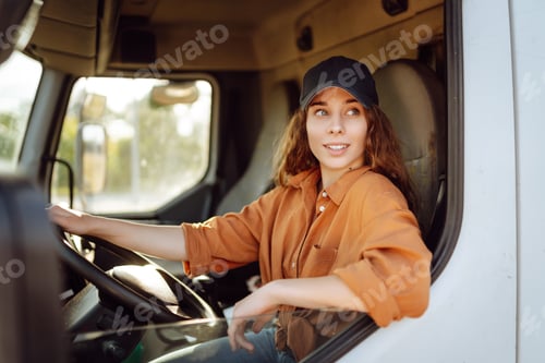 Female Truck Driver Smiling in the Cab