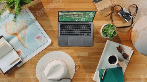 Aperçu: Flat lay top view desktop travel concept with laptop, maps and other travel essentials.