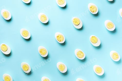Preview: Food concept with boiled eggs pattern on blue background. Top view. Creative pattern in minimal