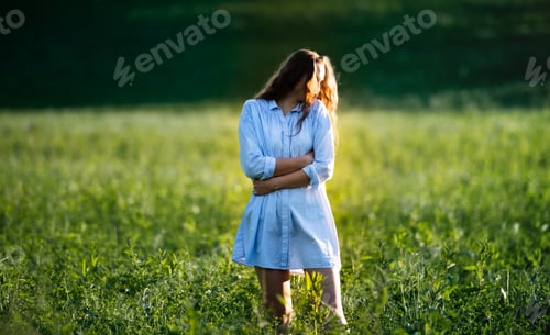 Preview: Portrait of young teenager girl outdoors in nature on meadow
