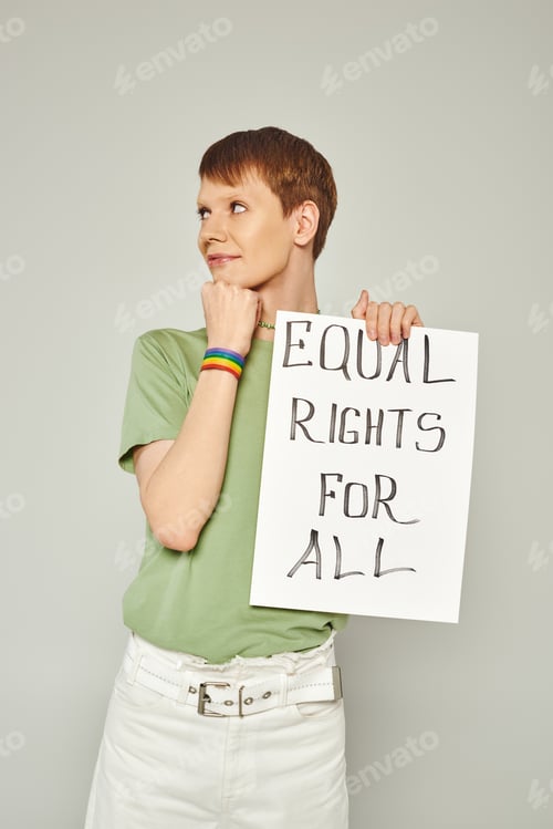 Preview: portrait of smiling queer activist wearing lgbt flag bracelet and holding placard with equal rights