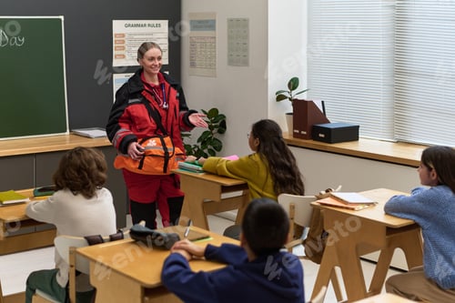 Preview: Middle Aged Caucasian Woman Paramedic Explaining Emergency Procedures to Children