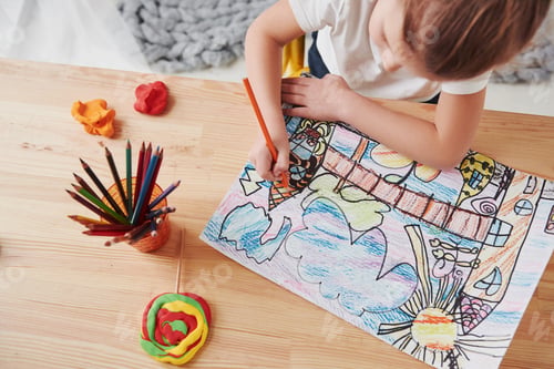Preview: Conception of art. Cute little girl in art school draws her first paintings by pencils and markers