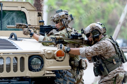 Preview: Two militaries or soldiers stay in front of humvee car area of car hood and point gun to left side