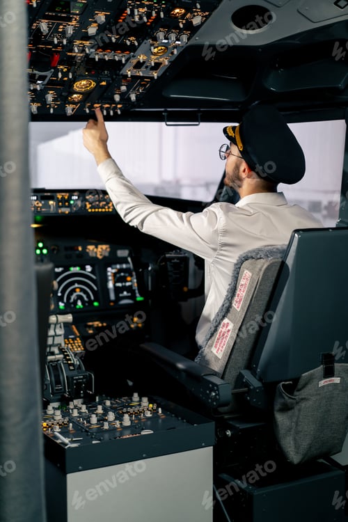 Preview: Airplane cabin The pilot checks the electronics by pressing the buttons Preparing passenger liner