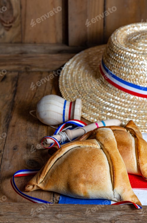 Preview: Chilean independence day concept. fiestas patrias. baked empanadas de pino, wine and play emboque