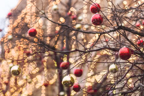 Preview: Streets fully decorated for Christmas with red and gold balls. Christmas tree in the city