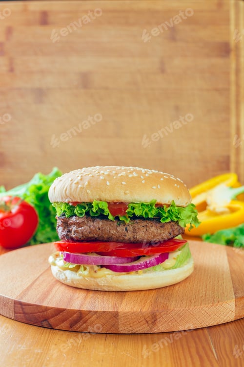Preview: Savory homemade burger with fresh ingredients on a wooden board in a cozy kitchen setting