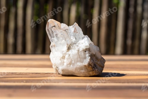 Preview: Natural clear quartz crystal on wooden surface
