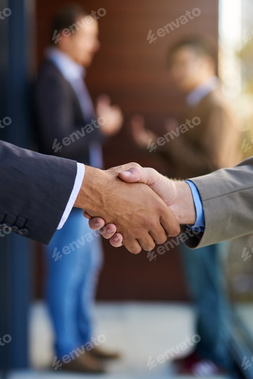 Preview: Business agreements. Shot of two businesspeople shaking hands.