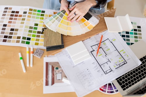 Preview: Woman architect working on interior renovation in workplace.