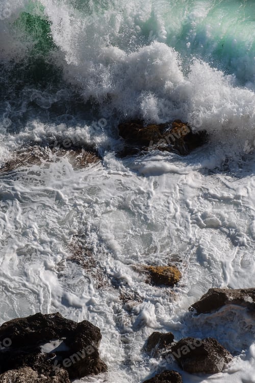 Preview: Ocean wave background breaking sea water rocky shore