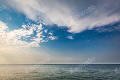 Preview: Dynamic sunset over calm sea in summer