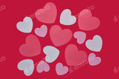 Preview: Random pink hearts on red background