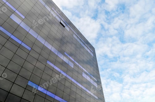Preview: Low angle exterior view of modern black and blue glass facade of the new Black Diamond building of