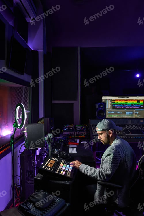Preview: Professional audio engineer mixing sound during recording in studio