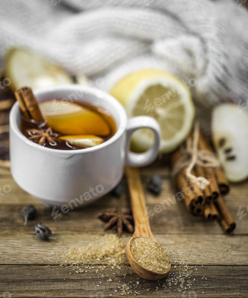 Preview: Cup of hot tea with lemon, a cinnamon stick
