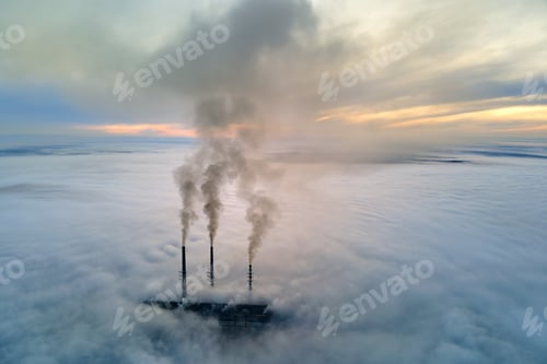 Preview: Aerial view of coal power plant high pipes with black smoke moving up polluting atmosphere at sunset
